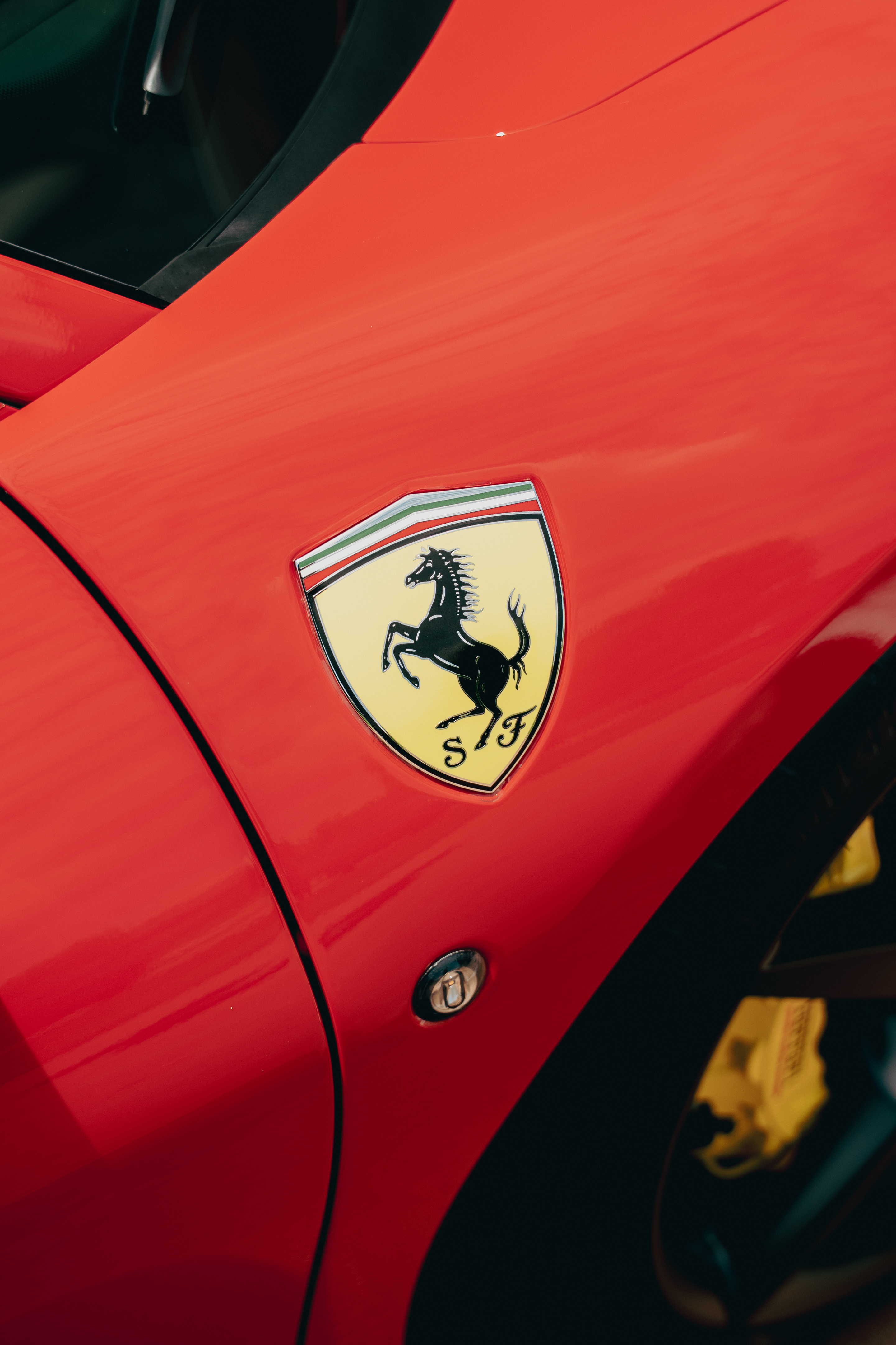 Scuderia Ferrari fender badge with yellow brake caliper