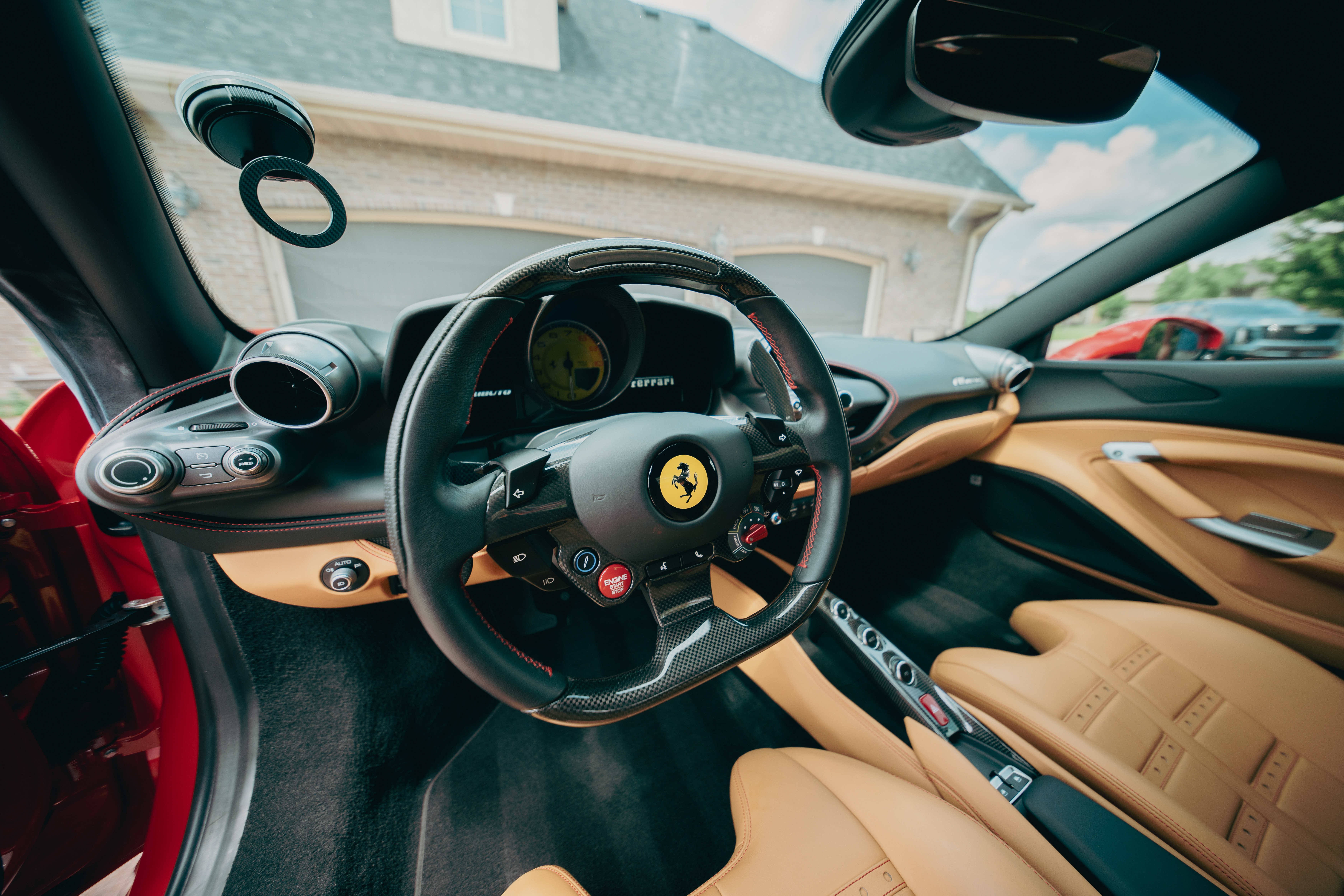 Ferrari F8 Tributo cockpit steering wheel and tan leather interior